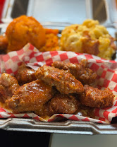 Saucy wings in a red checkered basket