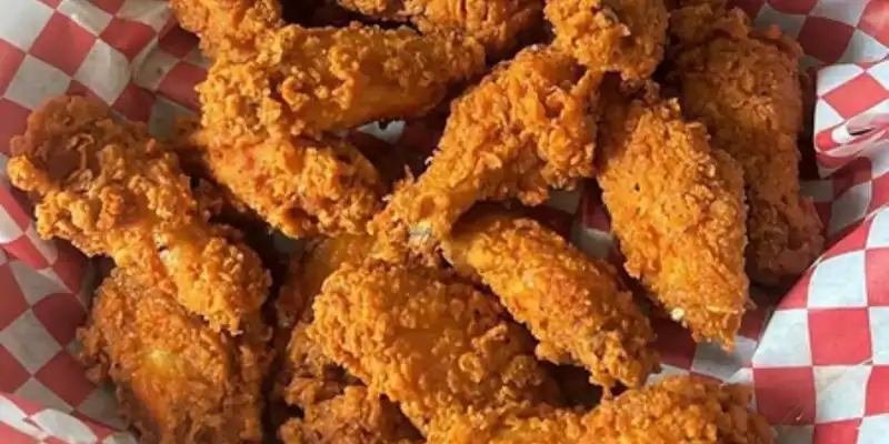 Basket of crispy fried chicken wings